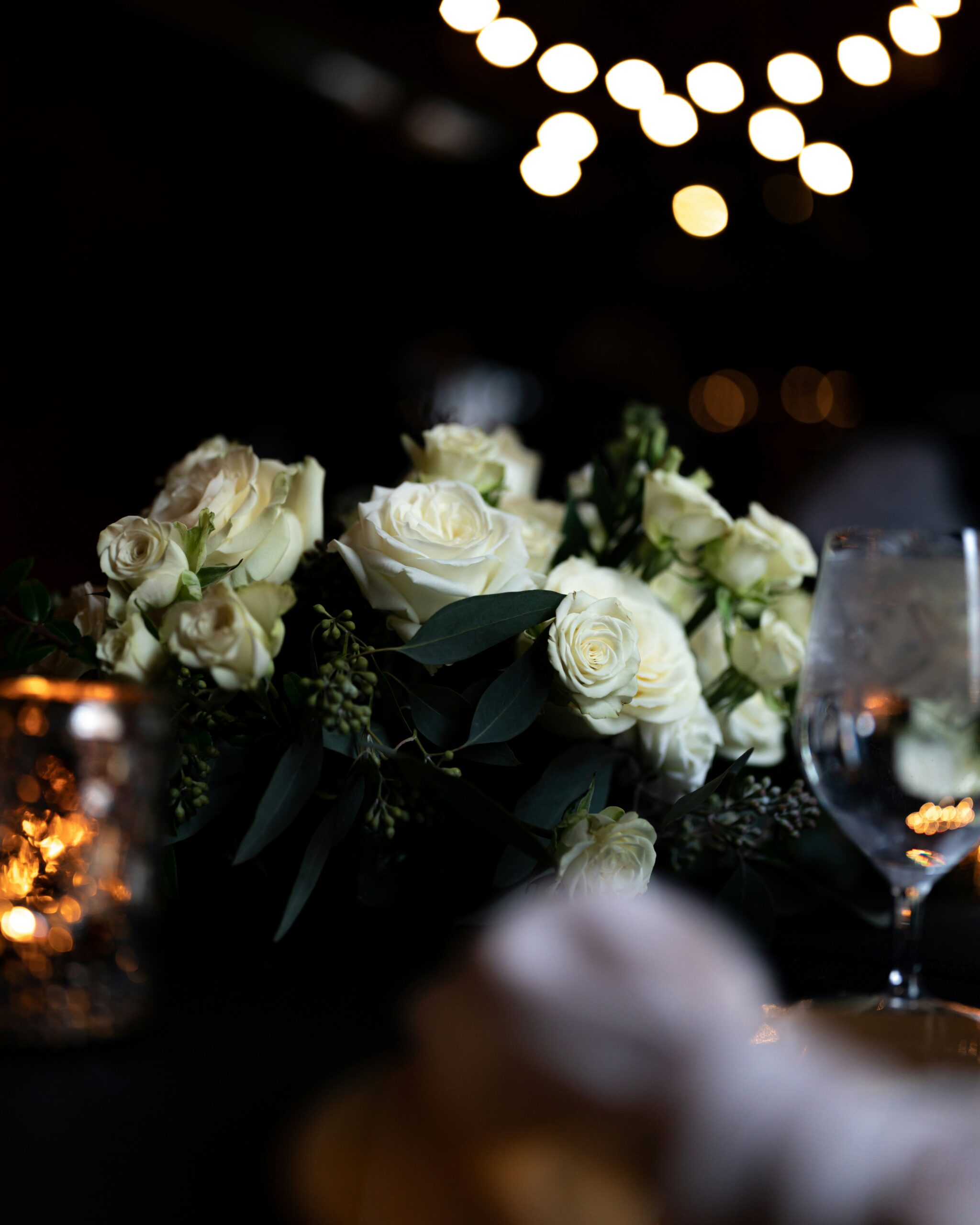 Elegant event venue with lush greenery, timeless accents, and white walls, showcasing the beauty of The White Windsor Barn, Greensburg's newest wedding and special events location.